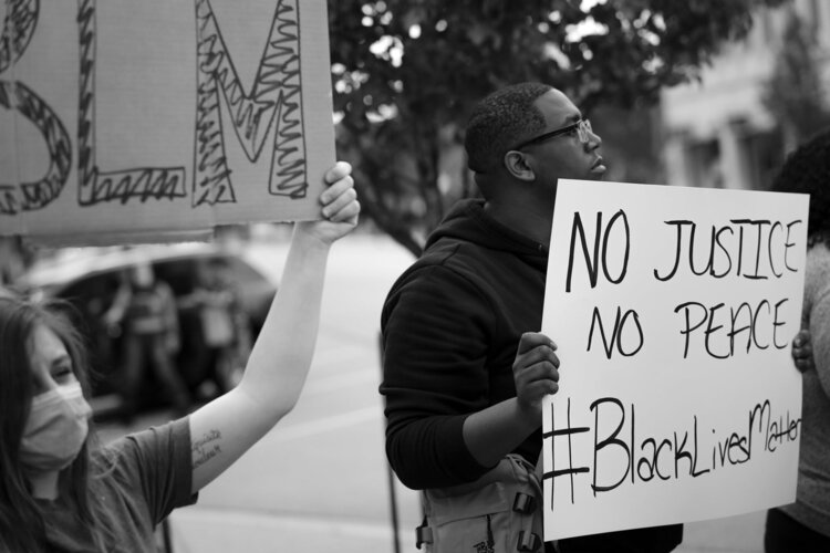In other parts of the nation, protests have turned violent. In the Great Lakes Bay Region, though, the protests have been peaceful. (PC: Phil Eich / Full Steam Social Media)