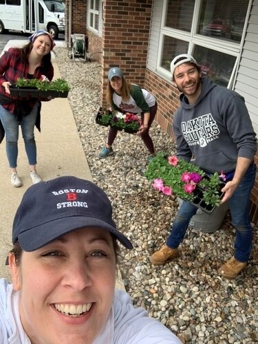Jenni Bush (front), Claire Wardin (left) Emily Schafer (center) and Tim Erskine (right) during planting.