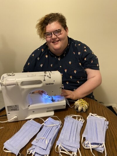 Josh Golden, a CMU senior from Lansing, drew out patterns to make 24 masks from a single yard of fabric. Now, he’s sewing them from home and sharing his pattern with other design students.