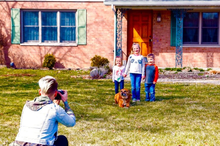 Since the portraits are taken at home, it’s easy to include family pets.