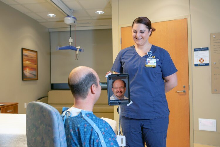 A patient consults with a doctor via iPad.