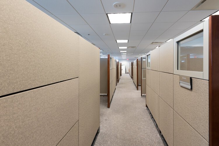 Before: A client's workspace that was walled off and separated.