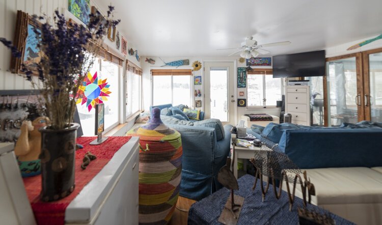 The pink paint of Bergeson’s cottage hints at the whirlwind of color inside the home. 