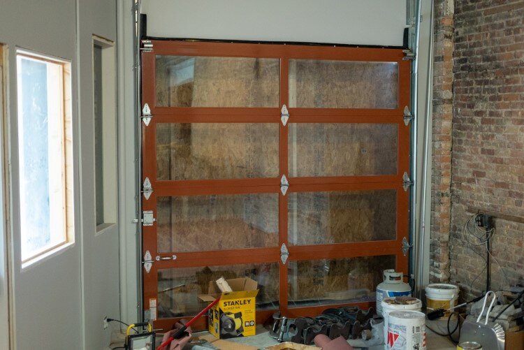 A garage door will soon open to outdoor seating and live music.