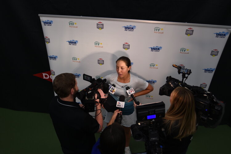 A player doing a media interview after match play.