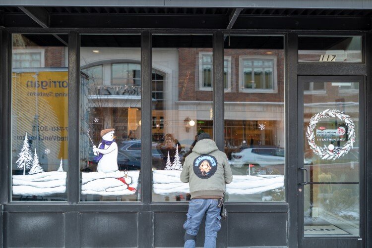 The group tailors all designs to each of the offices or businesses they paint.