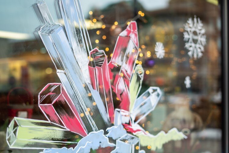 Crystals adorn the windows of Ways to Wellness