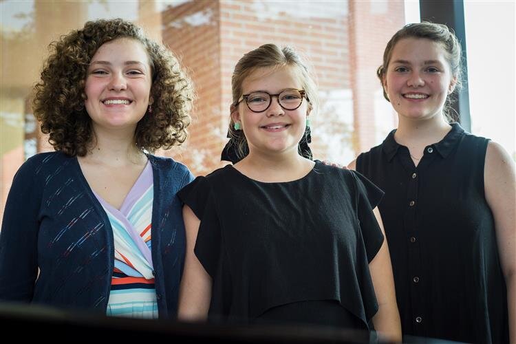 Sisters Natalie, Evie and Lydia Schram, who are all homeschooled, heard about the program through their church. 