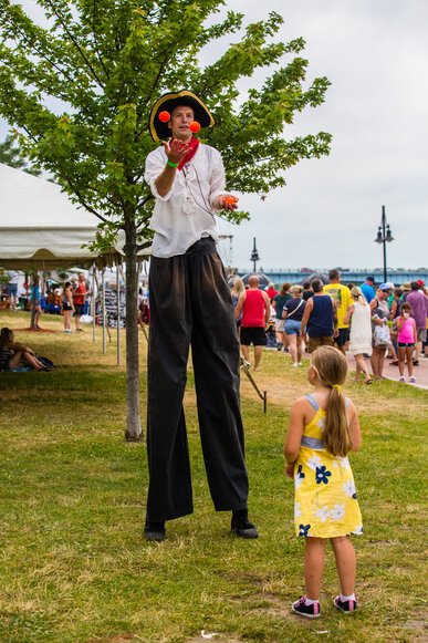 Entertainers and vendors keep the festive atmosphere going inside both parks.