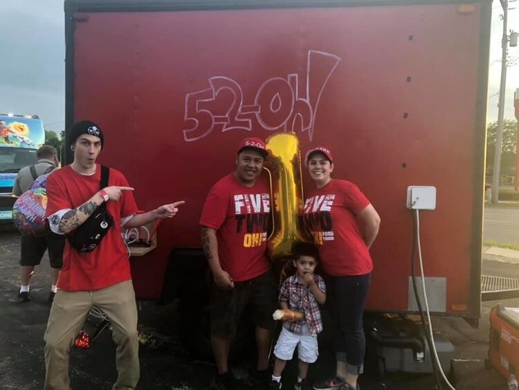 John and Autumn Filburn with their son on their first year anniversary with the 5-2-oh food truck.