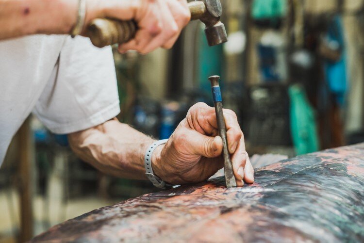 Jim working on the large copper bass in his studio.