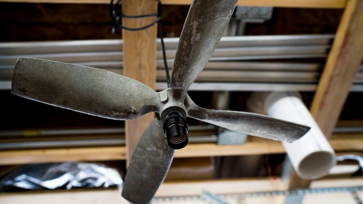 A propeller hangs in Acosta's studio in progress.