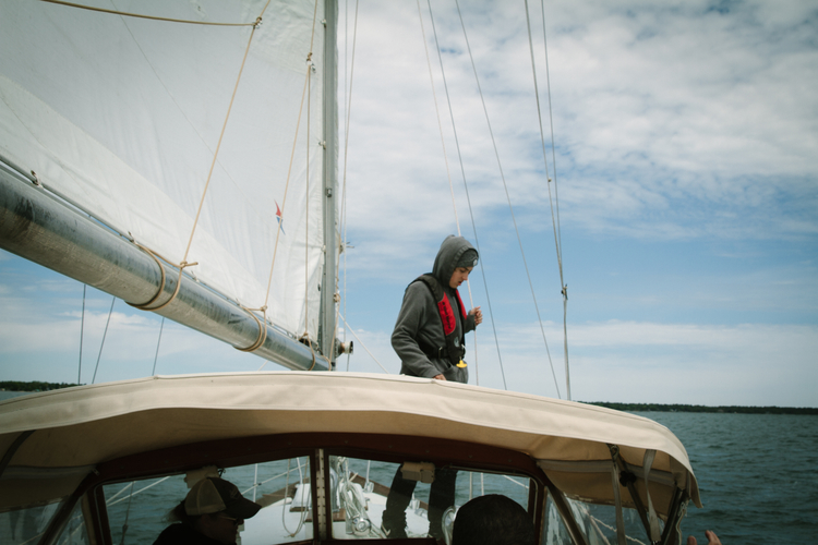 Gage DeGraw on deck during a sail in Tawas this spring.