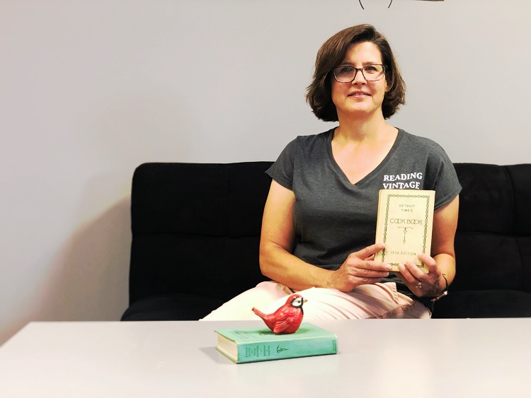 Pam Fournier with some of her vintage cookbooks.