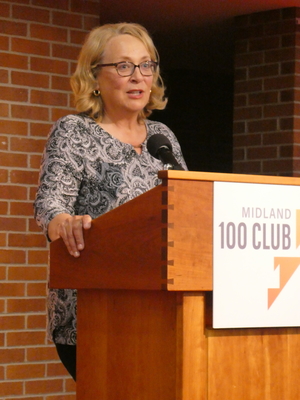 Midland 100 Founder Bobbie Arnold speaks during the May meeting.