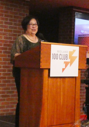 Tina Van Dam leads the meeting, which produces over $20,000 for two local nonprofits. 