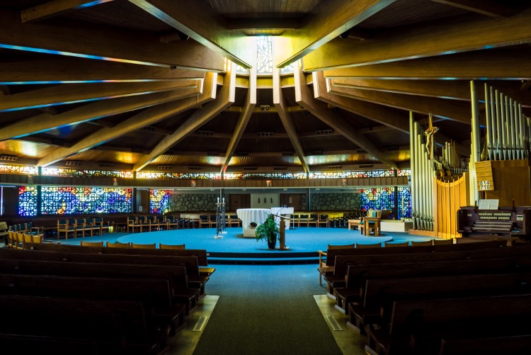 The round sanctuary design features 16 cedar arches.