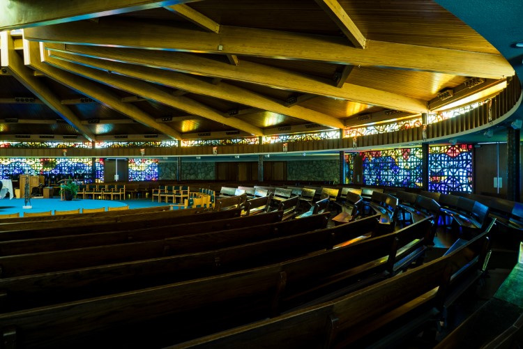 The stain glass windows designed and constructed by the late local artist and teacher James Hopfensperger.
