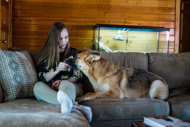 Cross at home with one of her two dogs.