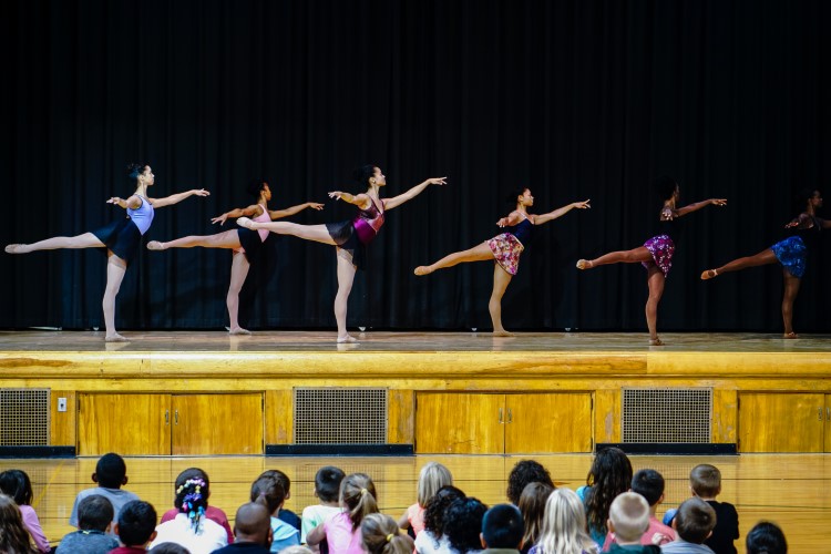 A dance team from Detroit performs for local elementary students to teach kids about other cultures.
