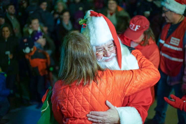 Santa greeting many fans in Downtown Midland.