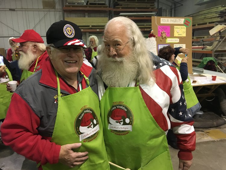 Fred Honerkamp and a friend working in Santa's toy shop.