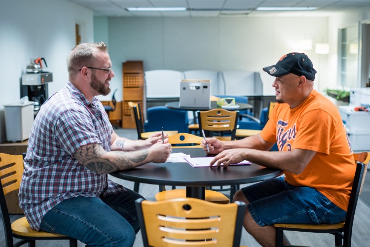 Brewer meets with a client at Ten16.