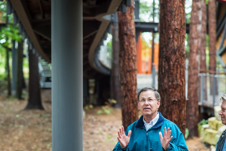 Mike Whiting Jr. discusses his inspiration for the project at the entrance to the canopy walk.