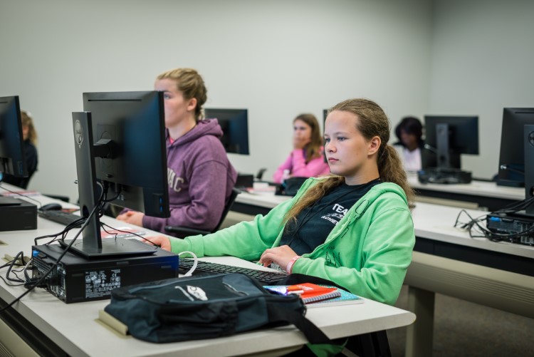 Olivia Cudney sits in classroom instruction. Th girls completed hands on projects and heard from local women leaders.