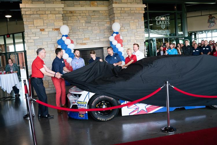 Jim Fitterling, Austin Dillon and others unveil the new paint job to the crowd at Dow Diamond