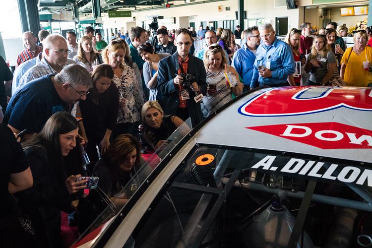 Dow employees and community members gather to get a look at the new car design.