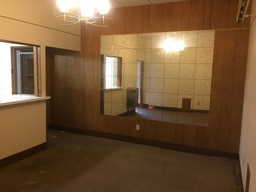 Bricks Real Estate's "before" picture. The building didn't have any windows and was in need of an overhaul.