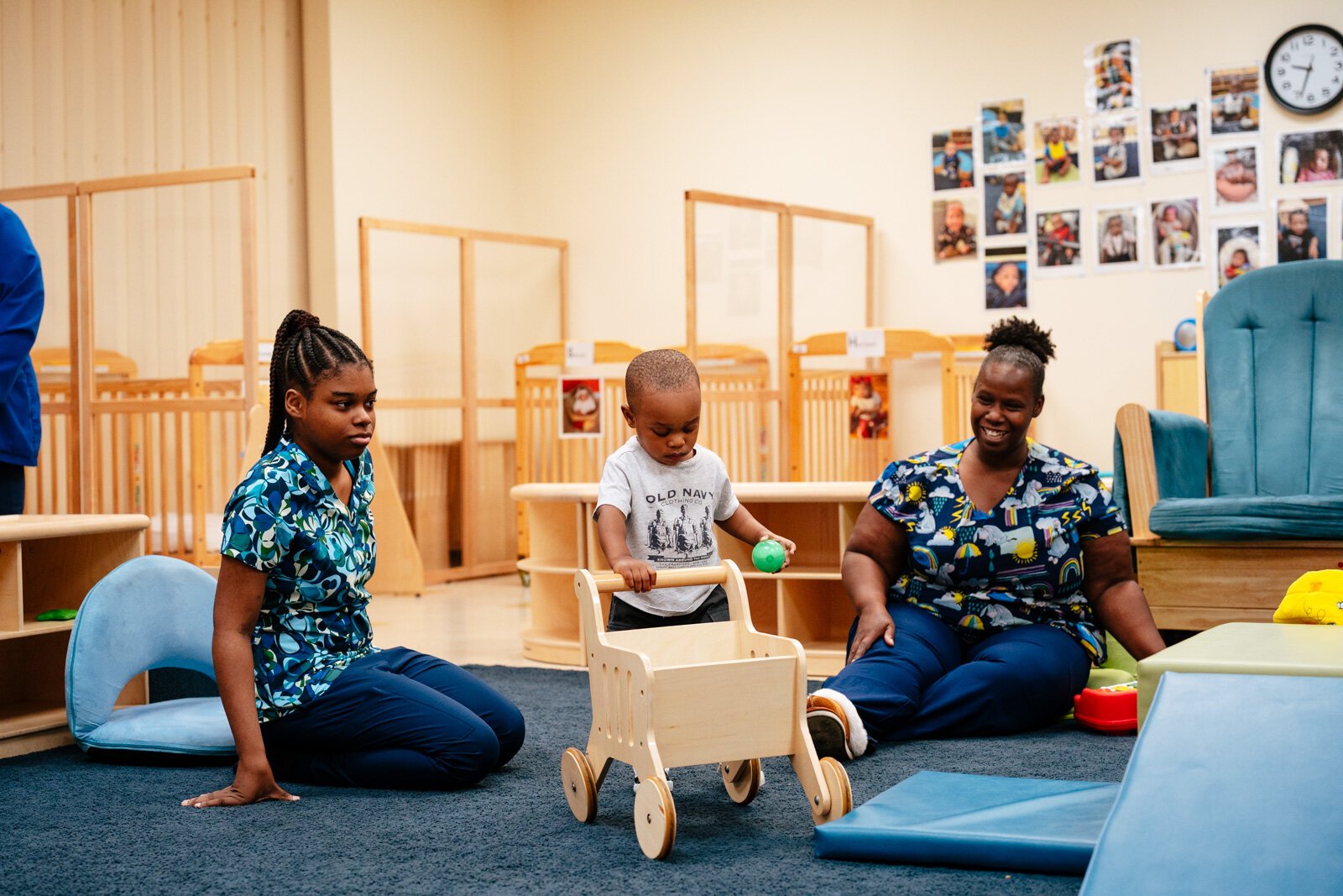 Teachers Madison Richardson and Alohna Alexander with a student at New St. Paul Head Start Agency in Detroit.