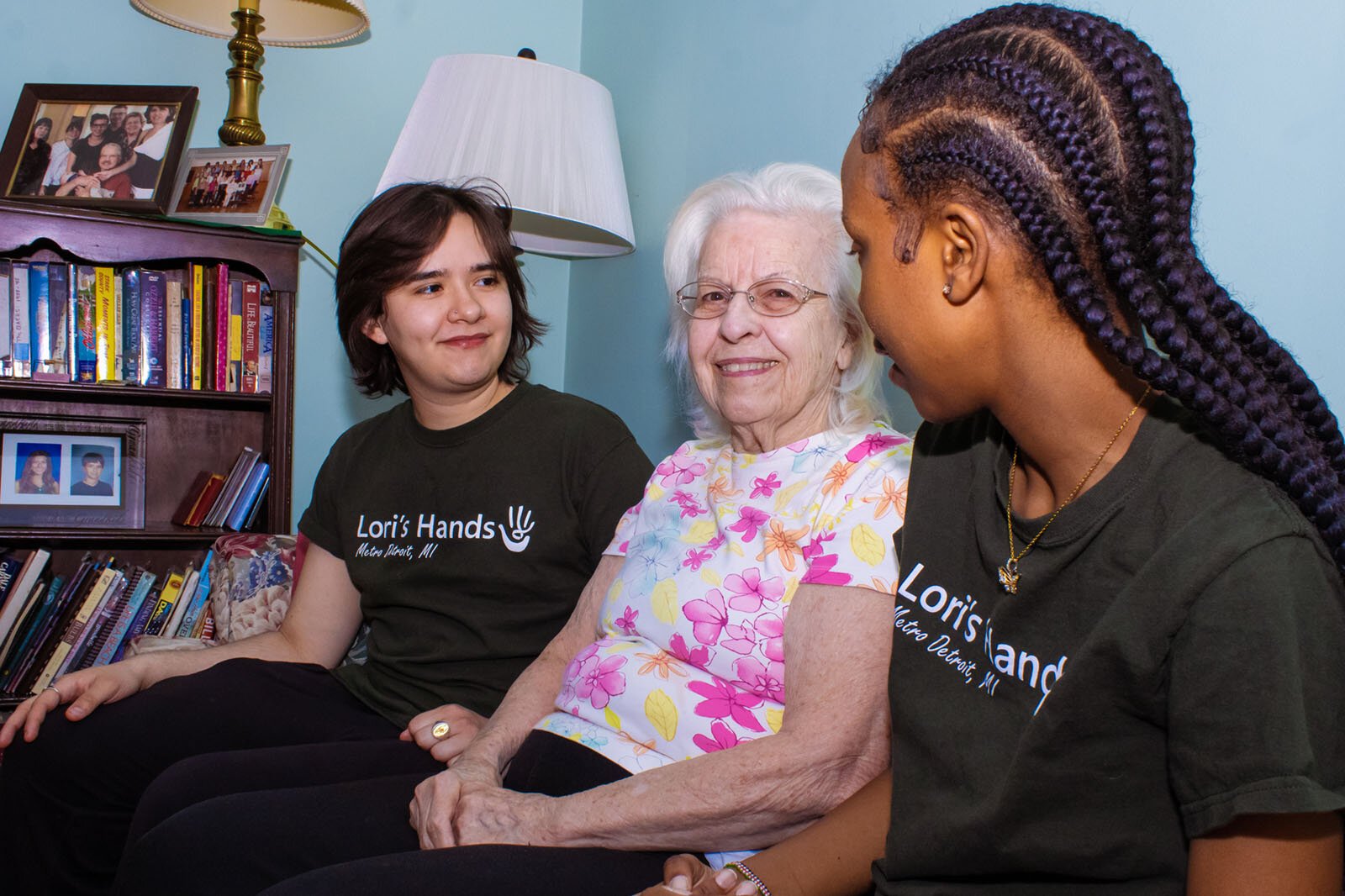 SOCIAL Program volunteers Keen Parra and Antonia Gitau with their client, Janet, at center.