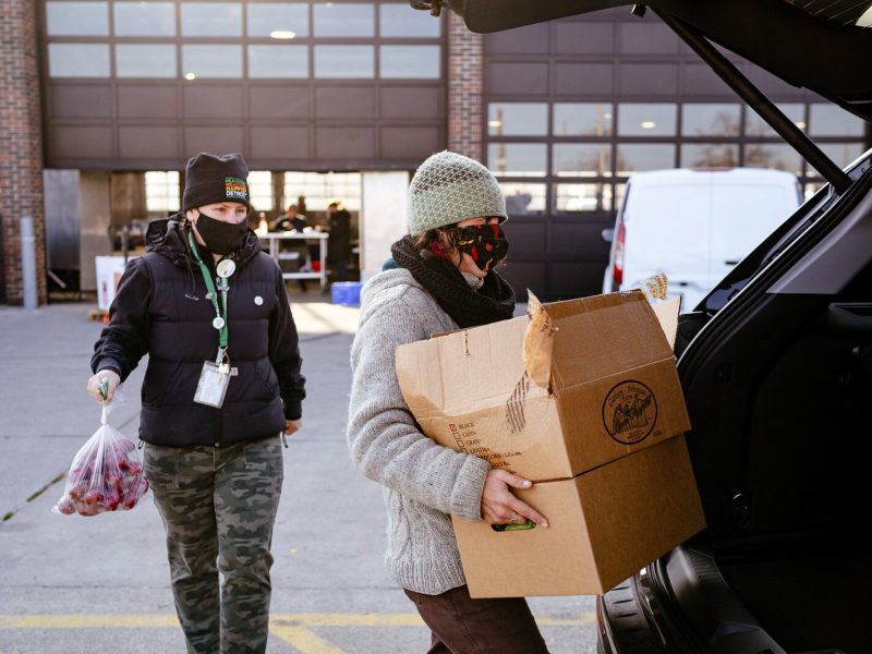 Eastern Market staff load food boxes that were ordered online.