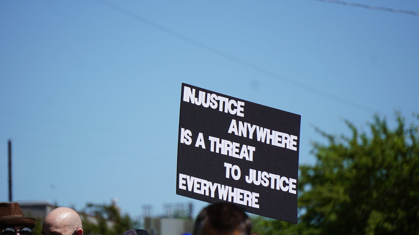 A sign held up at Midland's protest on June 7.