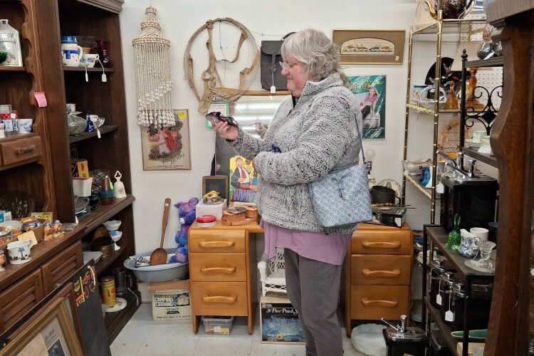 Shannon Zariski finds a glass shoe she's been searching for while antiquing.