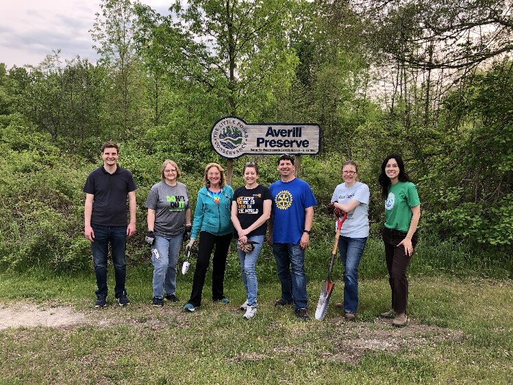 Club members partnering with the Little Forks Conservancy to plant pollinator-friendly plants at the Averill Preserve along the Pere Marquette Rail Trail.