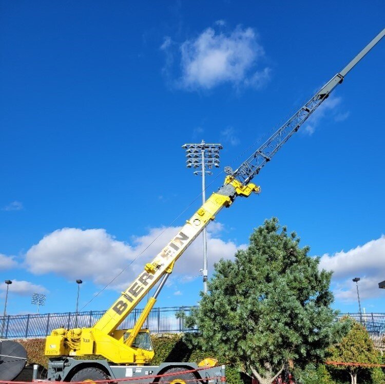 Lighting installation along right field line at Dow Diamond.