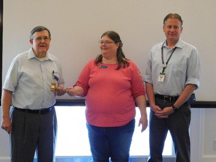 Current Midland Lions President Art Kuper receiving the gavel from Past President Lori Shelby-Hall.  Also pictured is Lion VP Scott Berry.