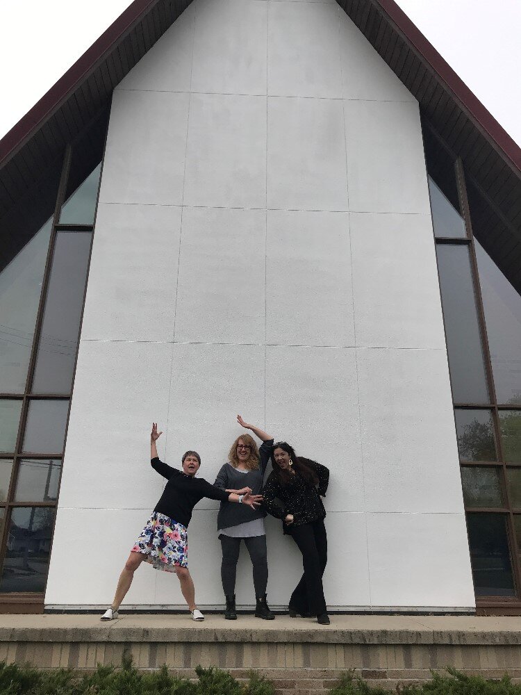 Creative 360 team "posing" outside new location.