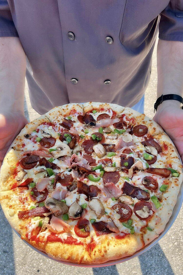 Pizza is one of the featured items.