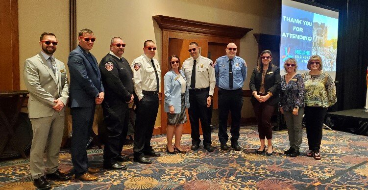 Representatives from the City of Midland sport their Max Loves Midland sunglasses at the Mayor's State of the City address.