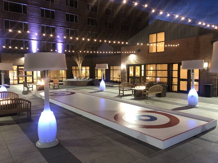 A curling rink is one of the features of the winter village.