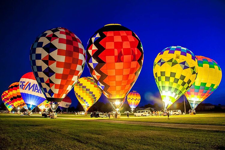 Hot air balloons lift off on Friday.
