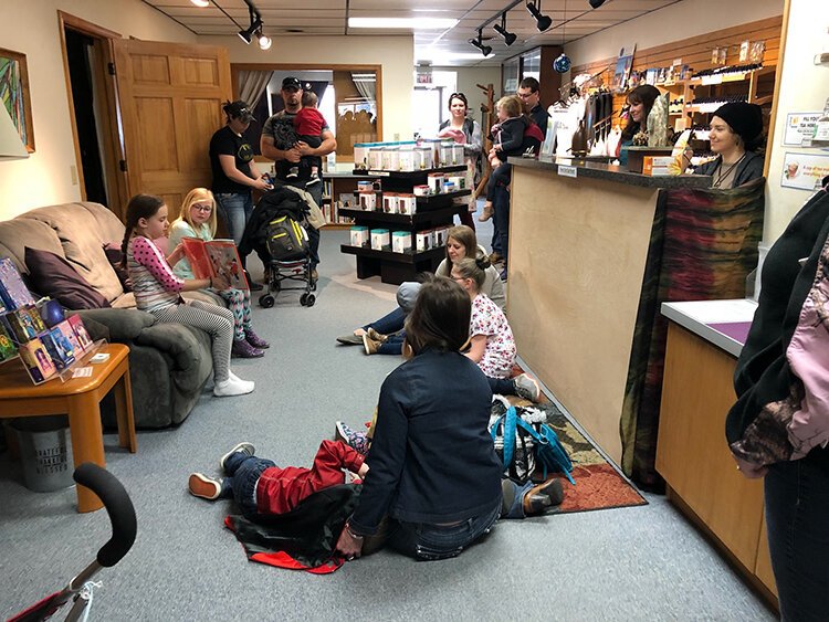 A story space will be set up in each business for children to hear a story reading. Reading times are staggered so that every half hour, storytelling will be happening. (Photo taken pre-COVID)