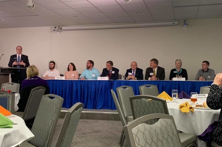 Panelists speak to attendees about the rewards and challenges of running a family business.