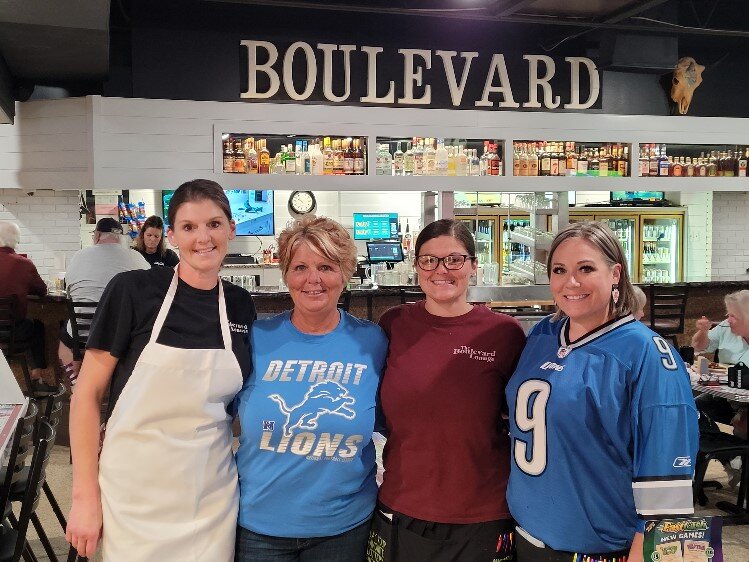 Liz Barringer, kitchen manager, Cherie Murray, owner, Veronica Murray, assistant manager, Vanessa Sedrowski, house day manager, in front of the new look bar.