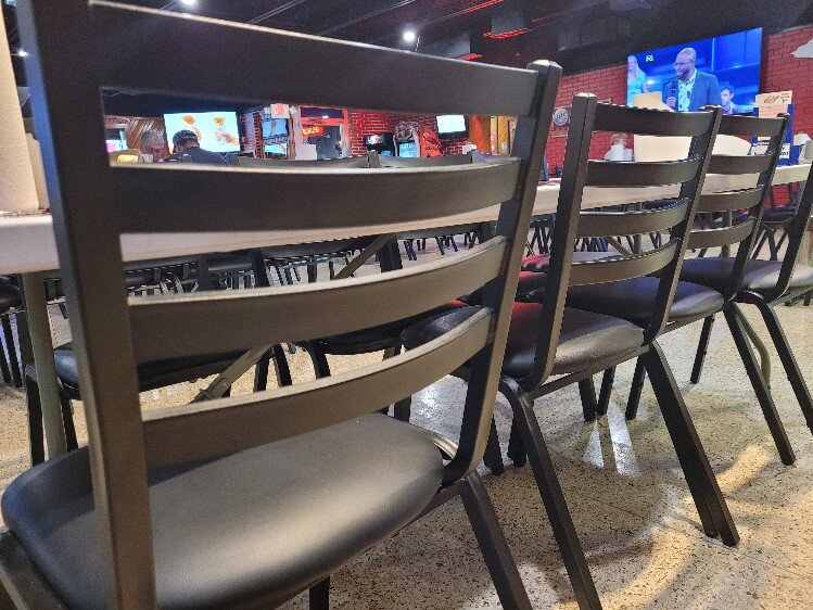 The Bully's renovation includes new chairs and tables.