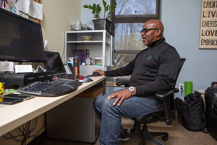 Arbor Circle therapist Marvin Mckenzie simulates a telehealth visit with a colleague.